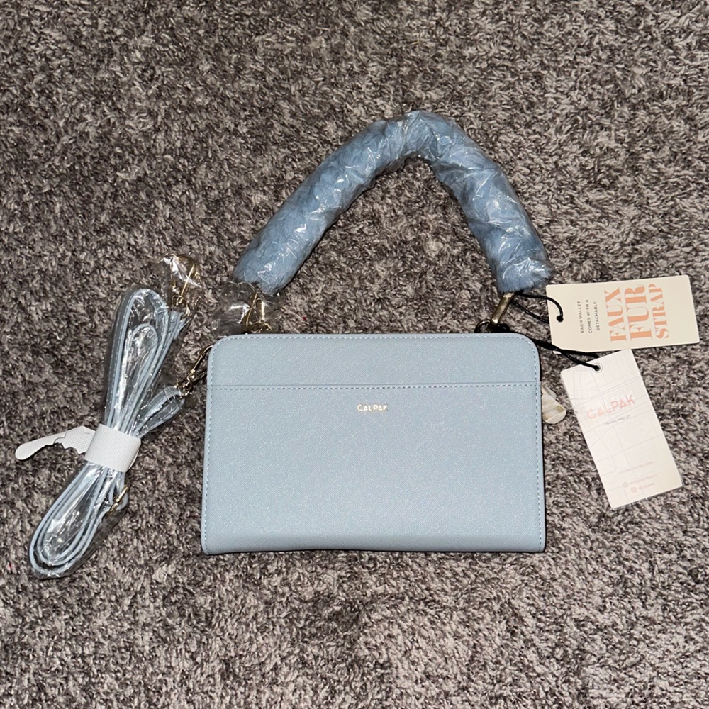 Calpak Travel Wallet with faux fur strap light blue